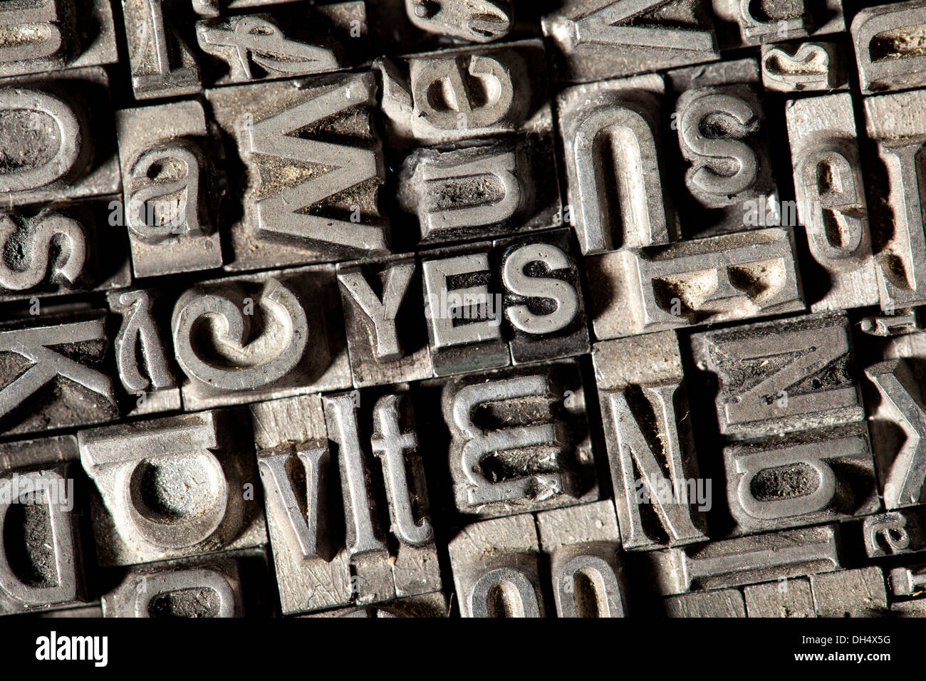 Old lead letters forming the word YES Stock Photo