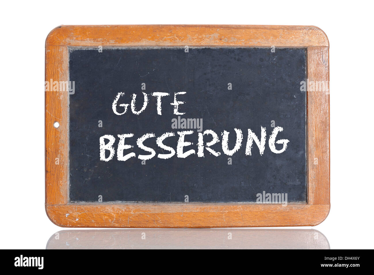 Old school blackboard with the words GUTE BESSERUNG, German for Get well soon Stock Photo