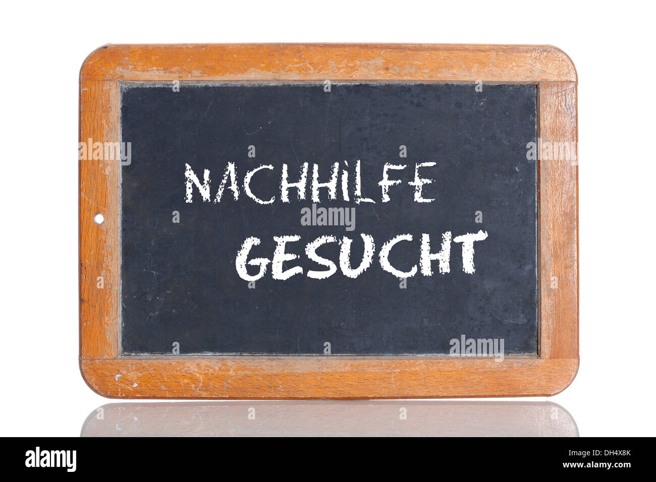 Old school blackboard with the words NACHHILFE GESUCHT, German for Tutor wanted Stock Photo