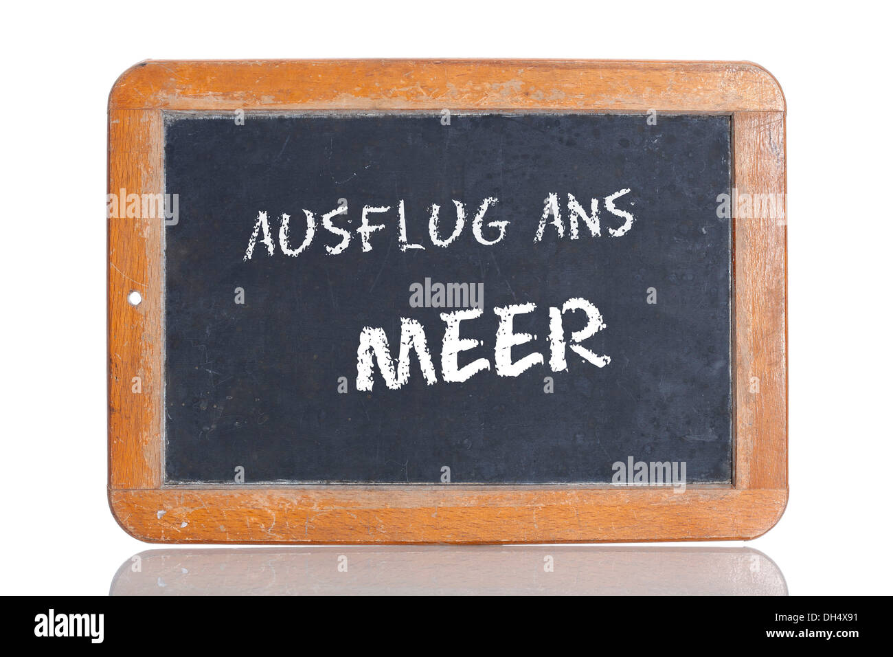 Old chalkboard, lettering 'AUSFLUG ANS MEER', German for 'TRIP TO THE COAST' Stock Photo