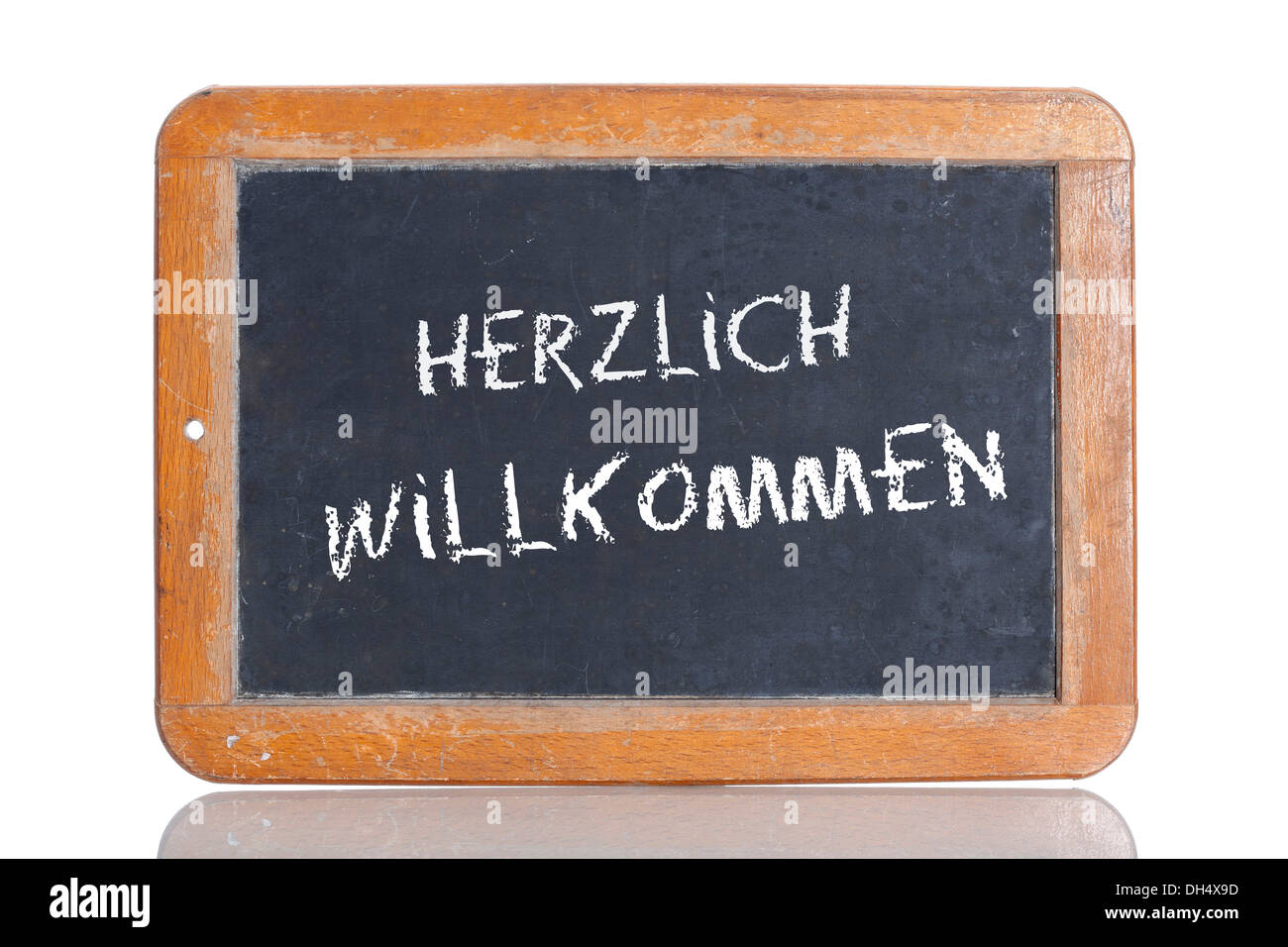 Old chalkboard, lettering 'HERZLICH WILLKOMMEN', German for 'WELCOME' Stock Photo