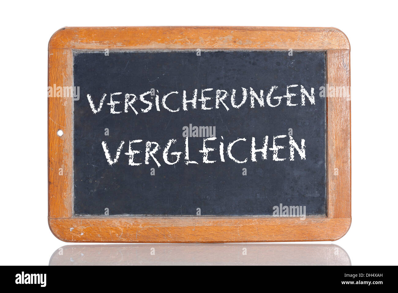 Old chalkboard, lettering 'VERSICHERUNGEN VERGLEICHEN', German for 'COMPARE INSURANCES' Stock Photo