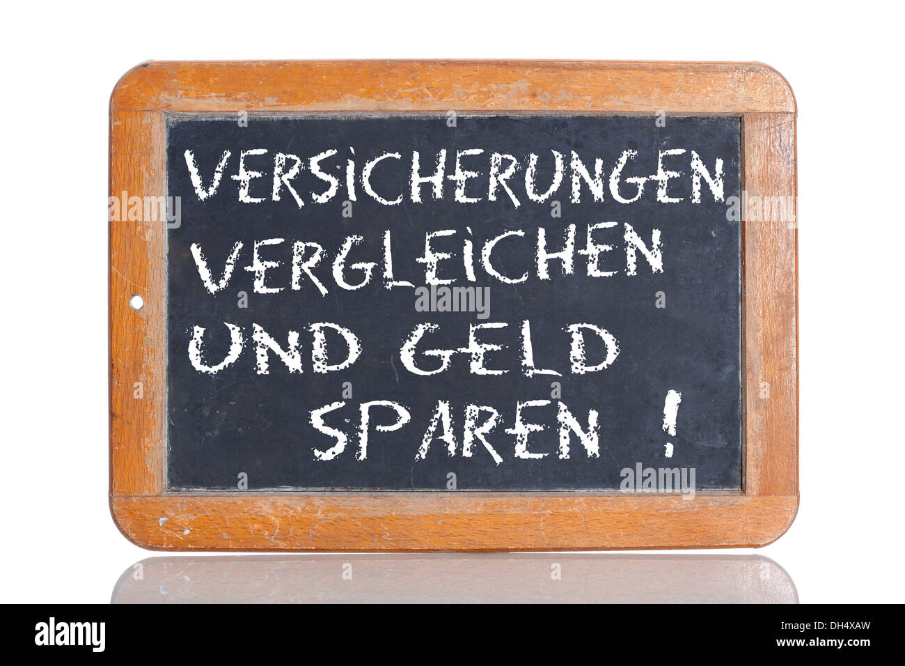 Old chalkboard, lettering 'VERSICHERUNGEN VERGLEICHEN UND GELD SPAREN!', German for 'COMPARE INSURANCES AND SAVE MONEY!' Stock Photo