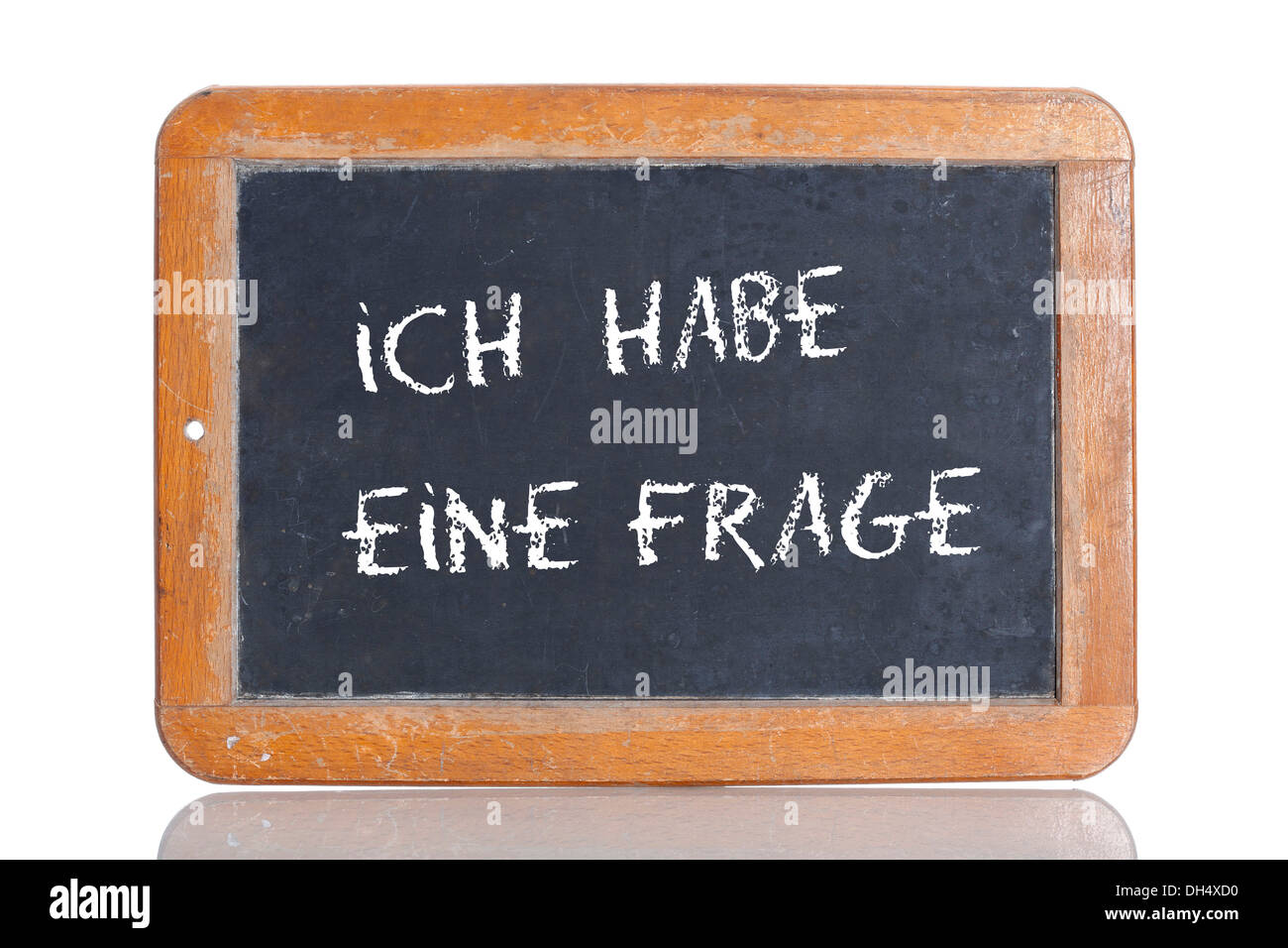 Old school blackboard with the words ICH HABE EINE FRAGE, German for I have a question Stock