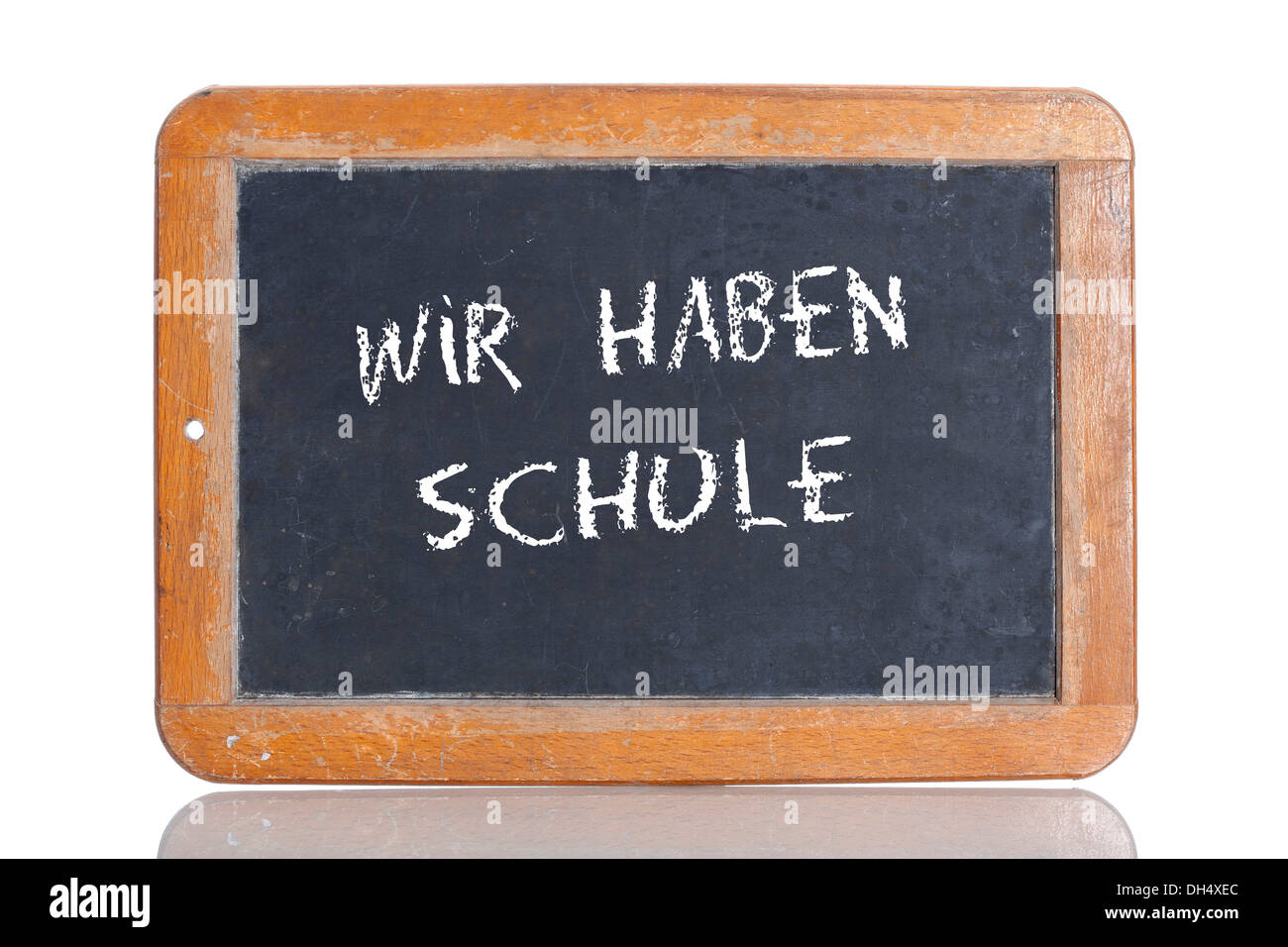 Old school blackboard with the words WIR HABEN SCHULE, German for We are at school Stock Photo