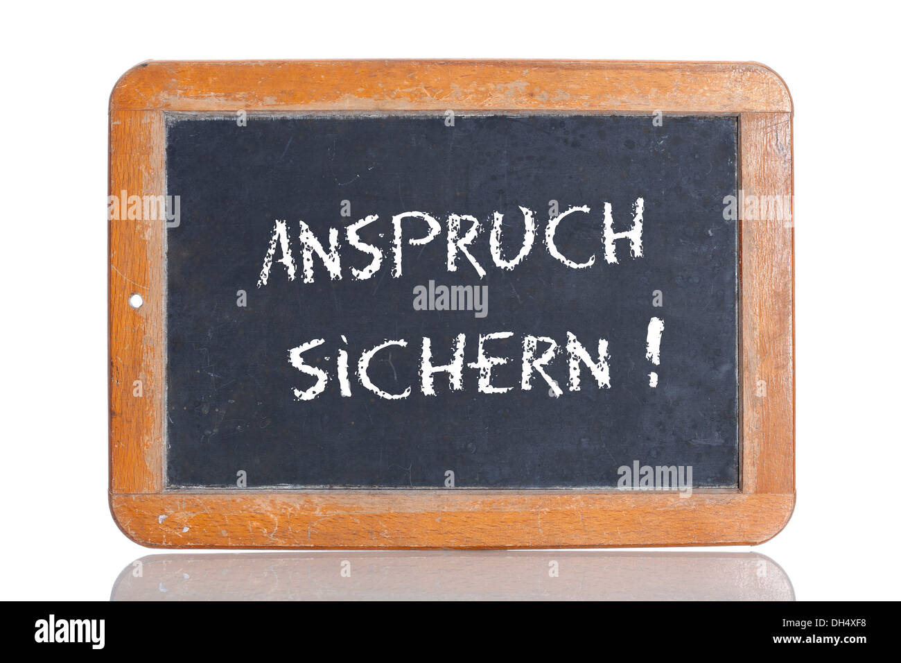 Old school blackboard with the words ANSPRUCH SICHERN!, German for Secure your claim! Stock Photo