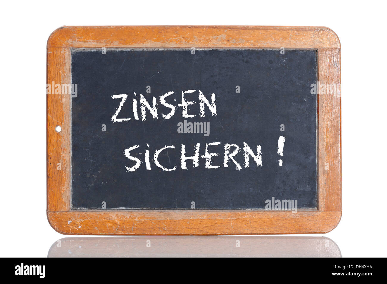 Old school blackboard with the words ZINSEN SICHERN!, German for Secure your interest rate! Stock Photo