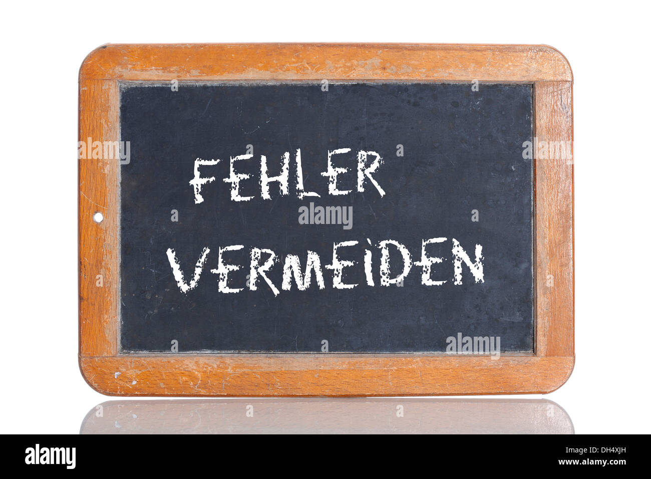 Old school blackboard with the words FEHLER VERMEIDEN, German for Avoid errors Stock Photo