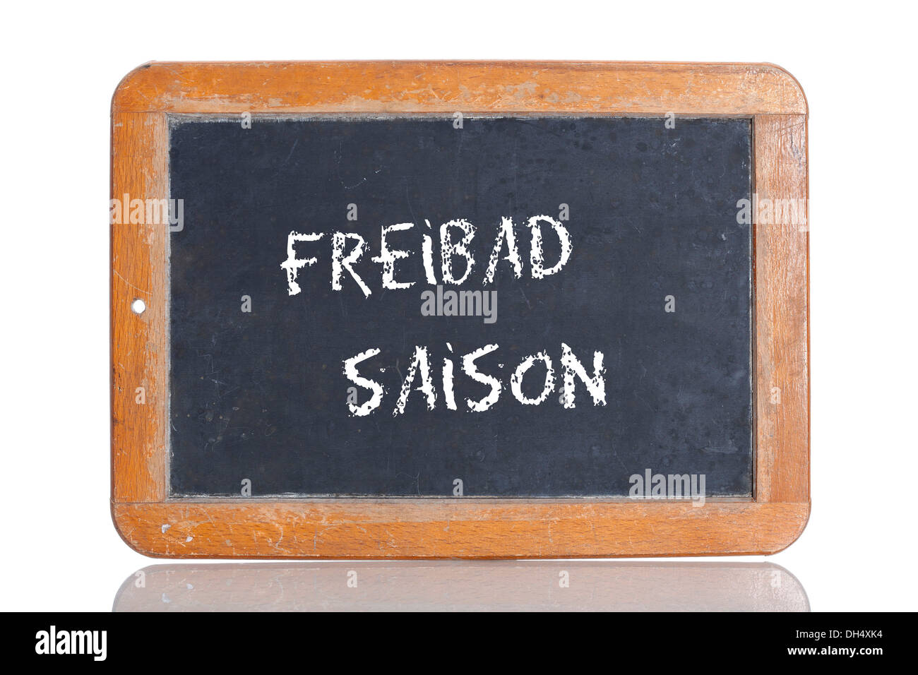 Old school blackboard with the words FREIBAD SAISON, German for Swimming pool season Stock Photo
