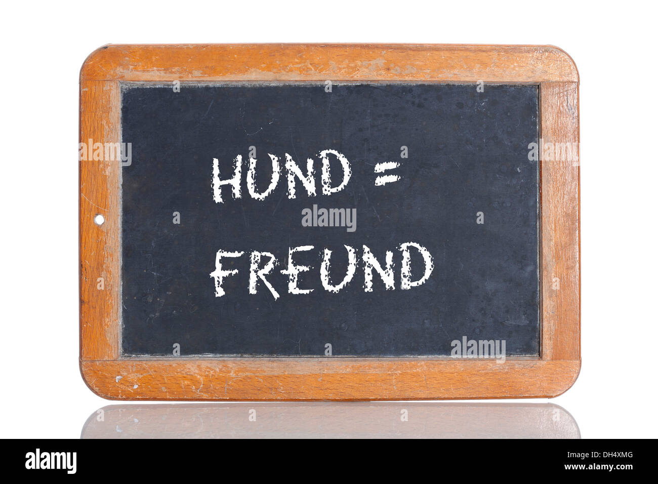 Old school blackboard with the words HUND = FREUND, German for Dog = Friend Stock Photo
