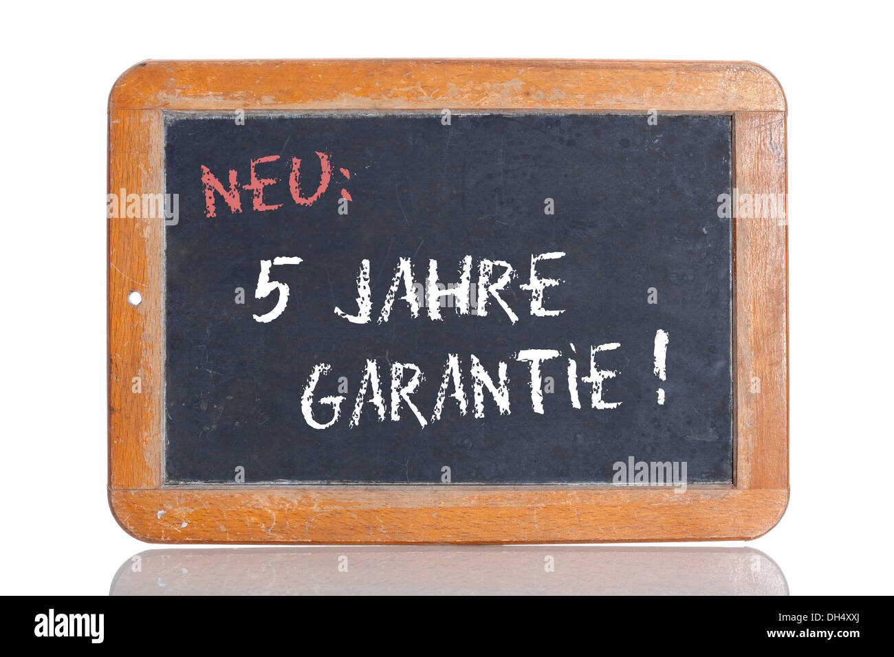 Old school blackboard with the words NEU: 5 JAHRE GARANTIE!, German for New: 5 year guarantee! Stock Photo