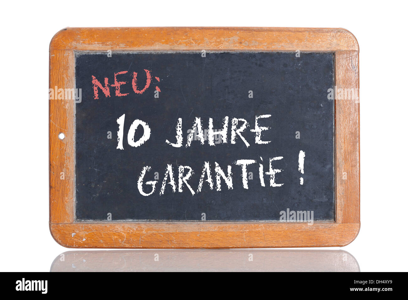 Old school blackboard with the words NEU: 10 JAHRE GARANTIE!, German for New: 10 year guarantee! Stock Photo
