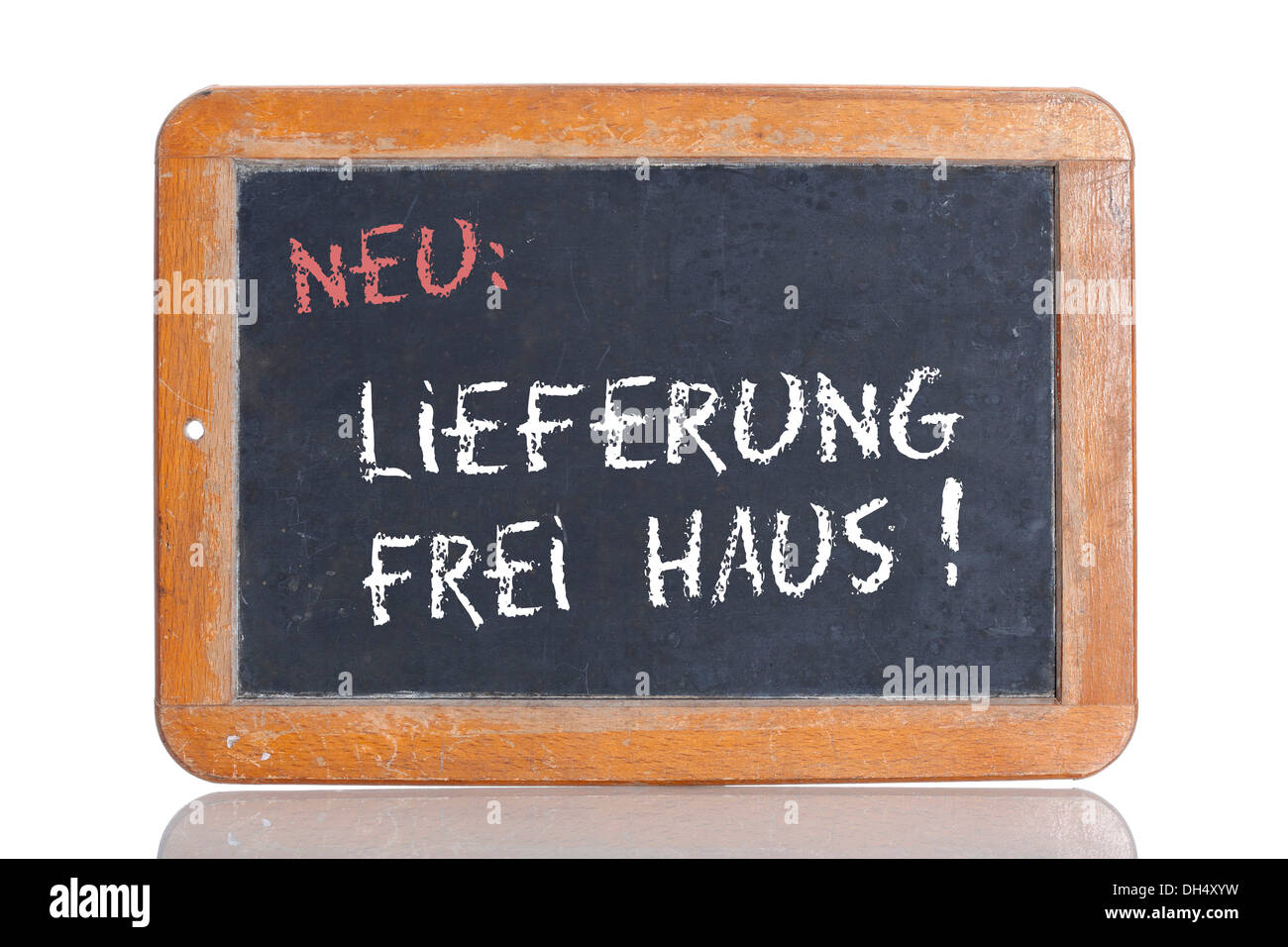 Old school blackboard with the words NEU: LIEFERUNG FREI HAUS!, German for New: Free delivery Stock Photo