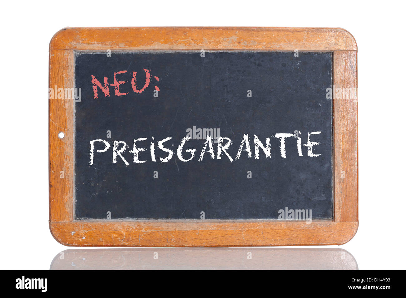 Old school blackboard with the words NEU: PREISGARANTIE, German for New: Guaranteed price Stock Photo