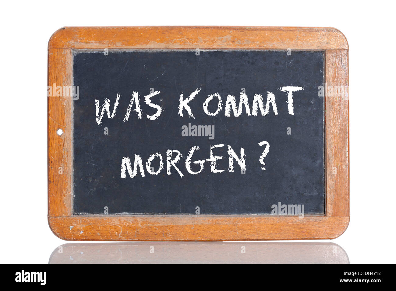 Old school blackboard with the words WAS KOMMT MORGEN?, German for What's will tomorrow bring? Stock Photo