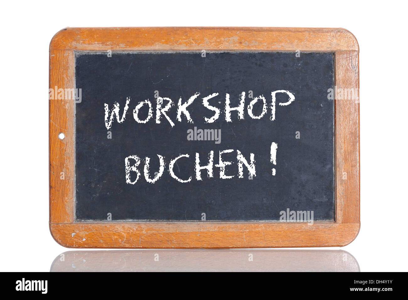 Old school blackboard with the words WORKSHOP BUCHEN!, German for Book a workshop! Stock Photo
