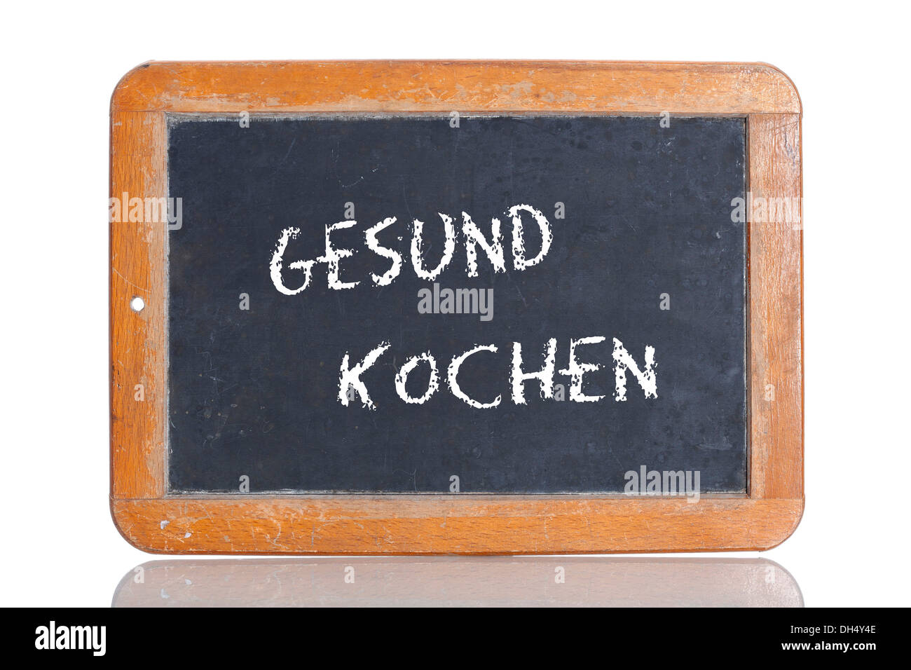 Old school blackboard with the term GESUND KOCHEN, German for healthy cooking Stock Photo