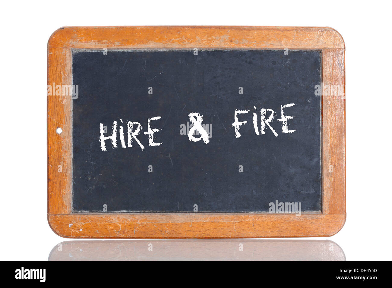 Old school blackboard with the term HIRE and FIRE Stock Photo