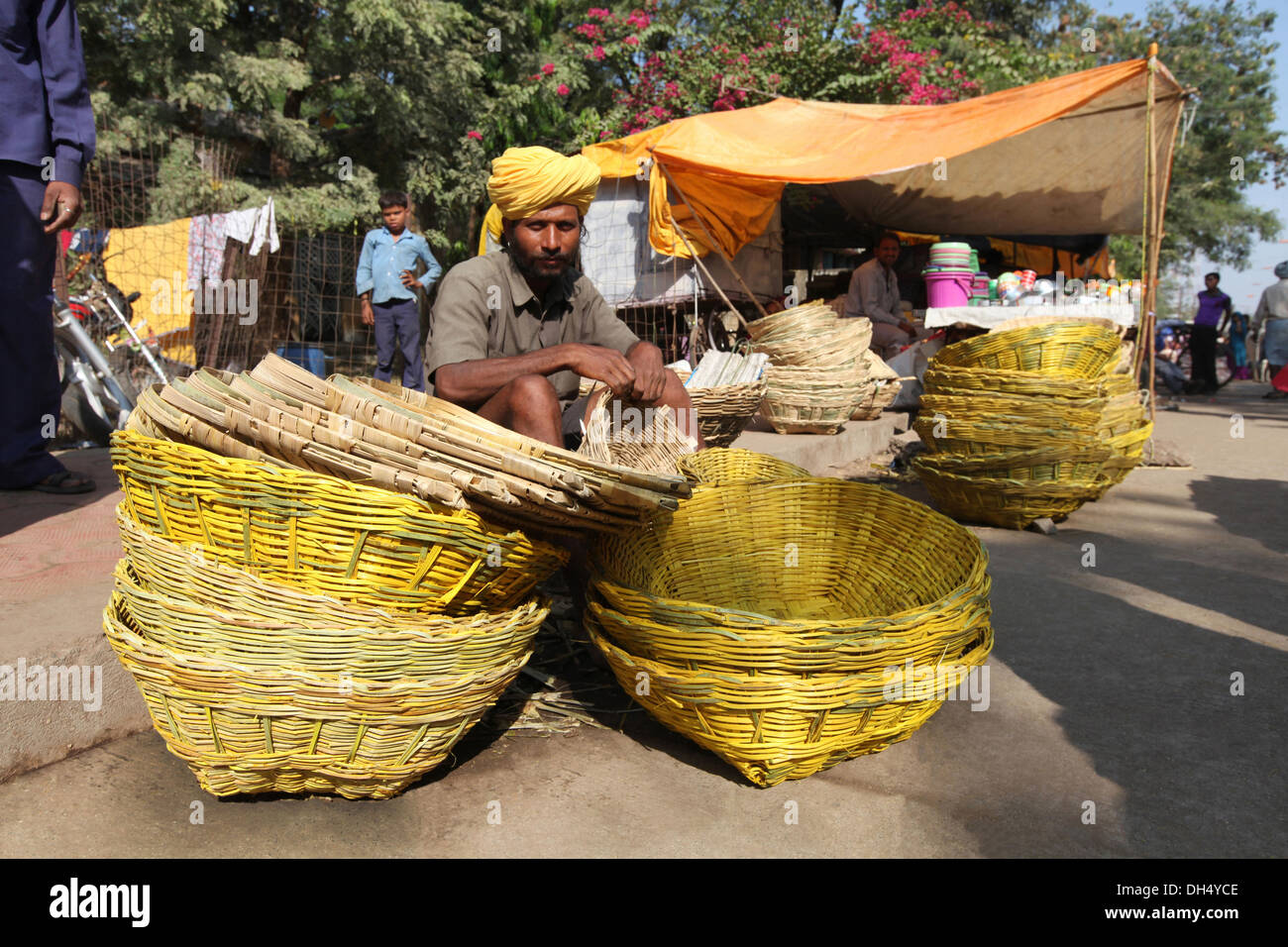 Vendor selling bambu baskets in a market, Jhabua, Madhya Pradesh, India Stock Photo