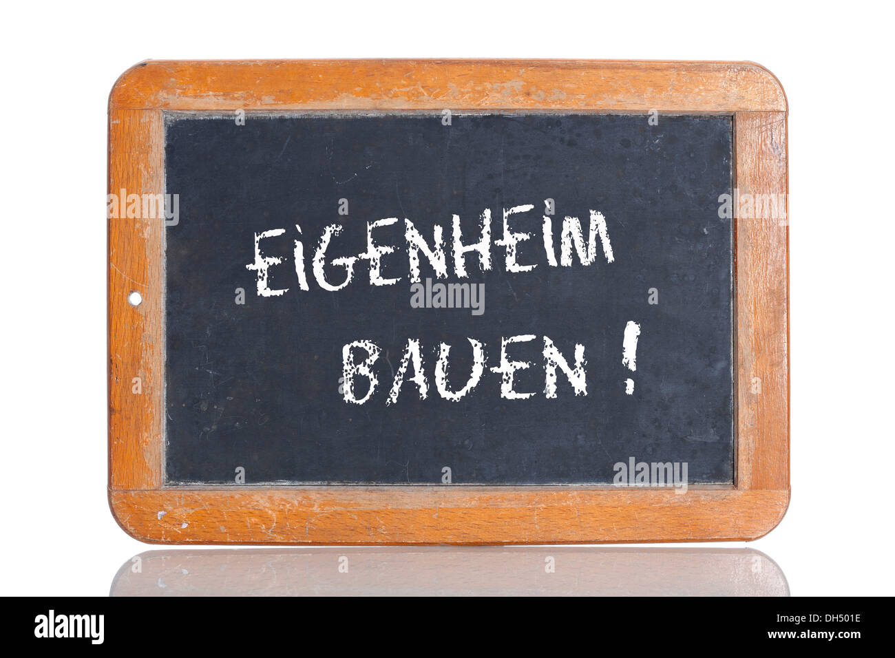 Old chalkboard, lettering 'EIGENHEIM BAUEN', German for 'BUILD A HOUSE' Stock Photo