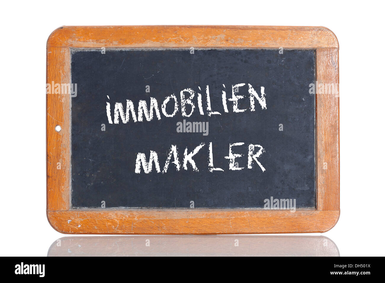 Old chalkboard, lettering "IMMOBILIENMAKLER", German for "REAL ESTATE