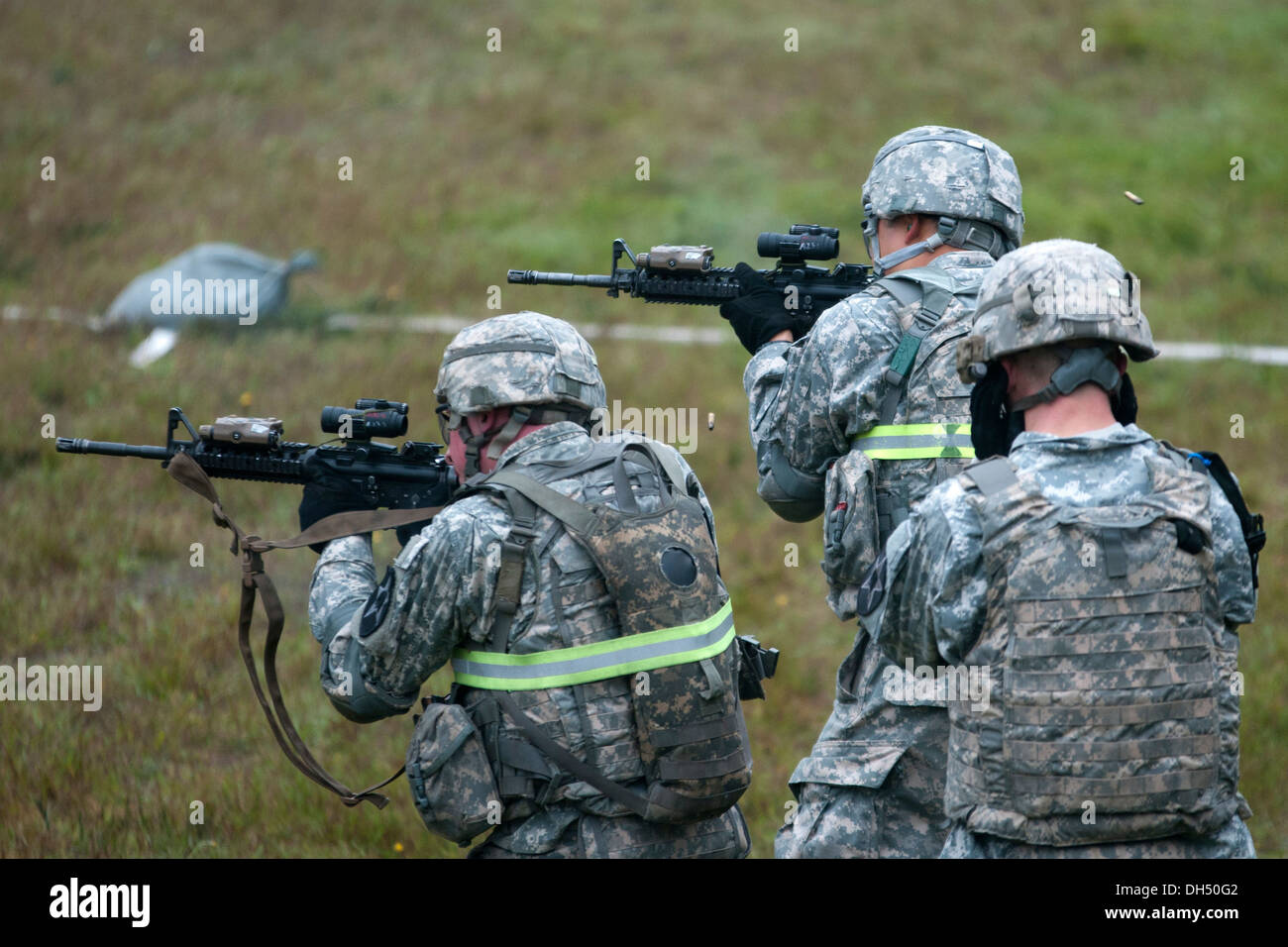 Soldiers with Company A, 2nd Battalion, 1st Infantry Regiment, 2-2 Stryker Brigade Combat Team, 7th Infantry Division engage targets during a stress shoot at Joint Base Lewis-McChord, Wash., Oct. 23. The stress shoot tested the Soldiers' ability to fire u Stock Photo