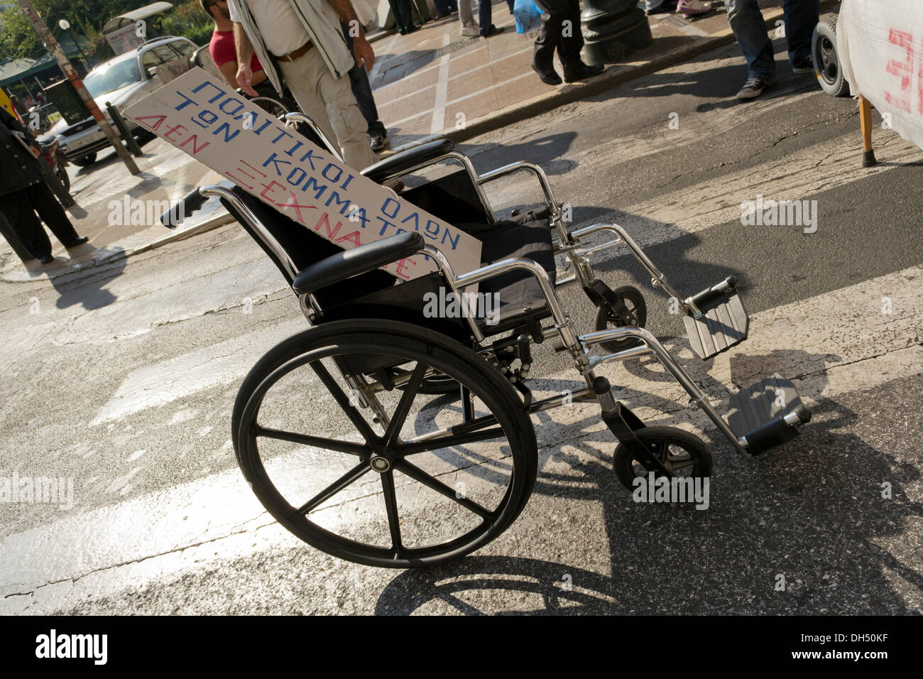 Athens, Greece. 31st October 2013. People with disabilities stage a demonstration to protest against austerity. They headed to the Ministry of Finance to protest and shout slogans, as with taxing increasing during the recent years of the economic crisis, they find it hard to cope with costs incurred by their disabilities.  Credit:  Nikolas Georgiou / Alamy Live News Stock Photo