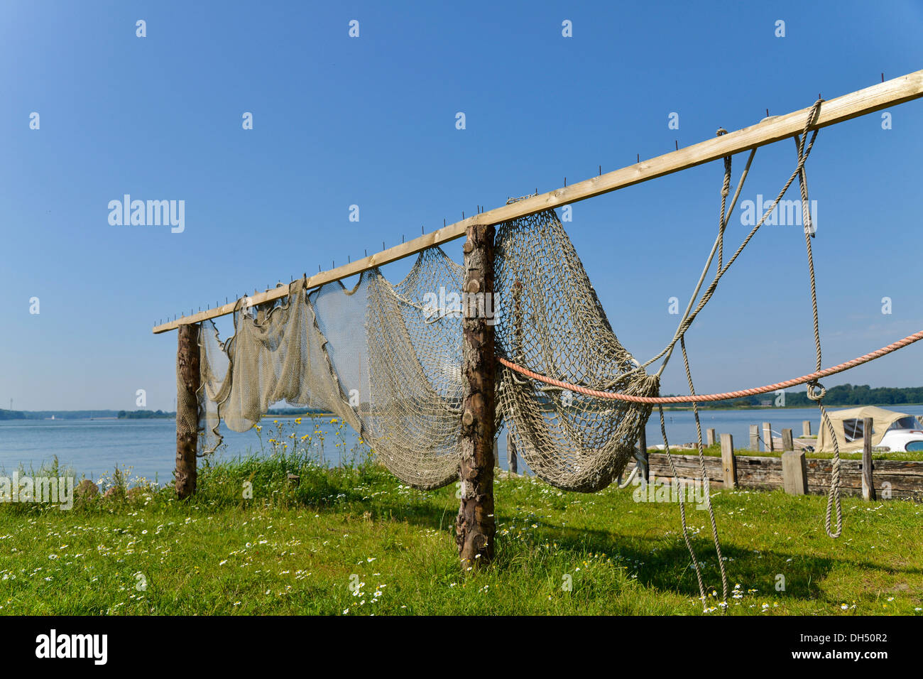 Fishing Net Draped Loosely Alongside a Row of Big Game Fish Hooks Stock  Image - Image of drying, dark: 170219763