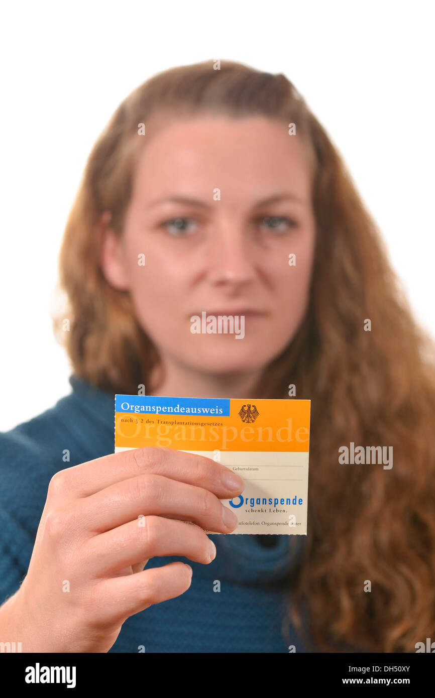 Woman holding an organ donor card Stock Photo