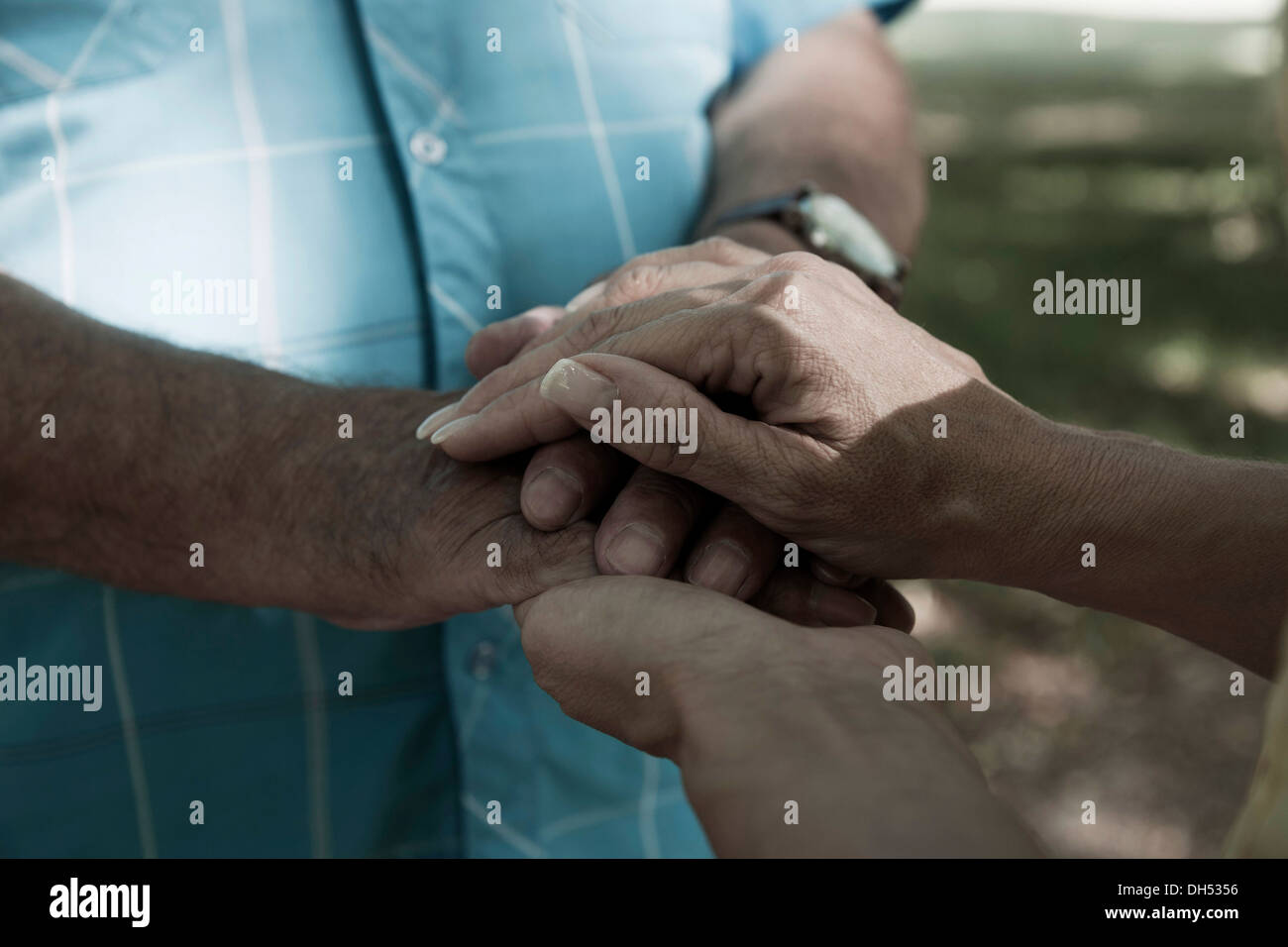 A man and a woman holding each other hands Stock Photo