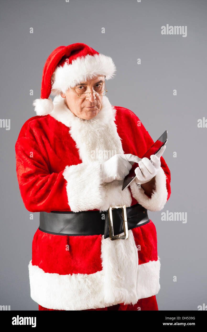 Santa Claus with a tablet PC Stock Photo - Alamy