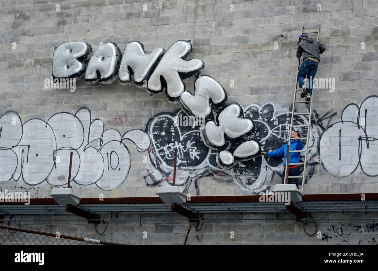 Banksy Inflatable Raft Queens, New York, USA. 31st October 2013. Police arrest suspects who ...