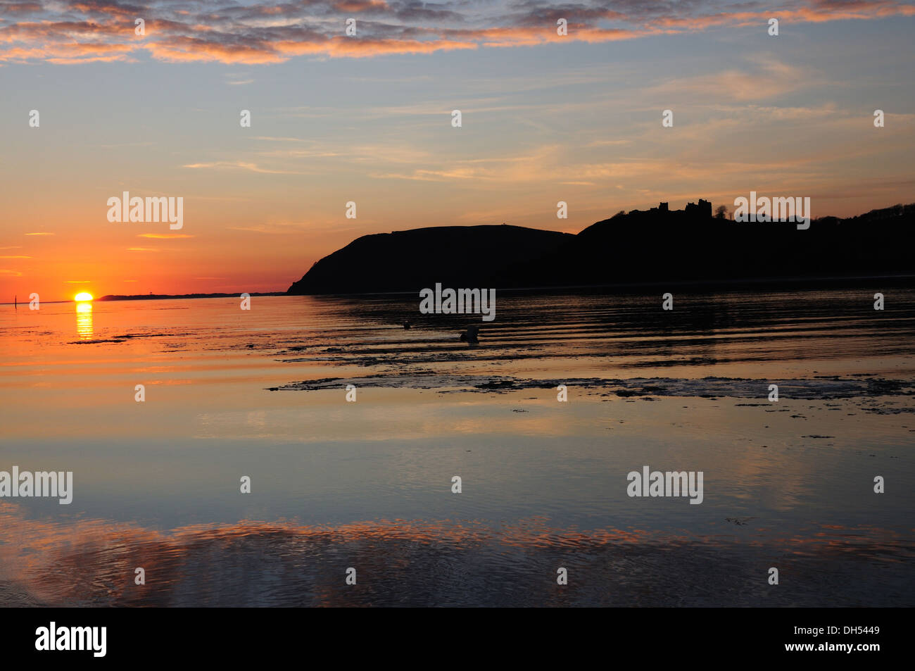 Mackerel sky at sunset over Llansteffan Castle and Tywi Estuary from Ferryside Carmarthenshire