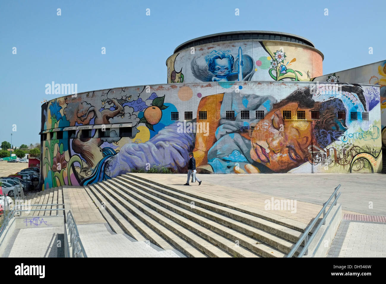 Street art by Spanish artist El Niño de las Pinturas (aka Raul Ruiz) on the rear of the bus station at Seville, Andalusia, Spain. Stock Photo