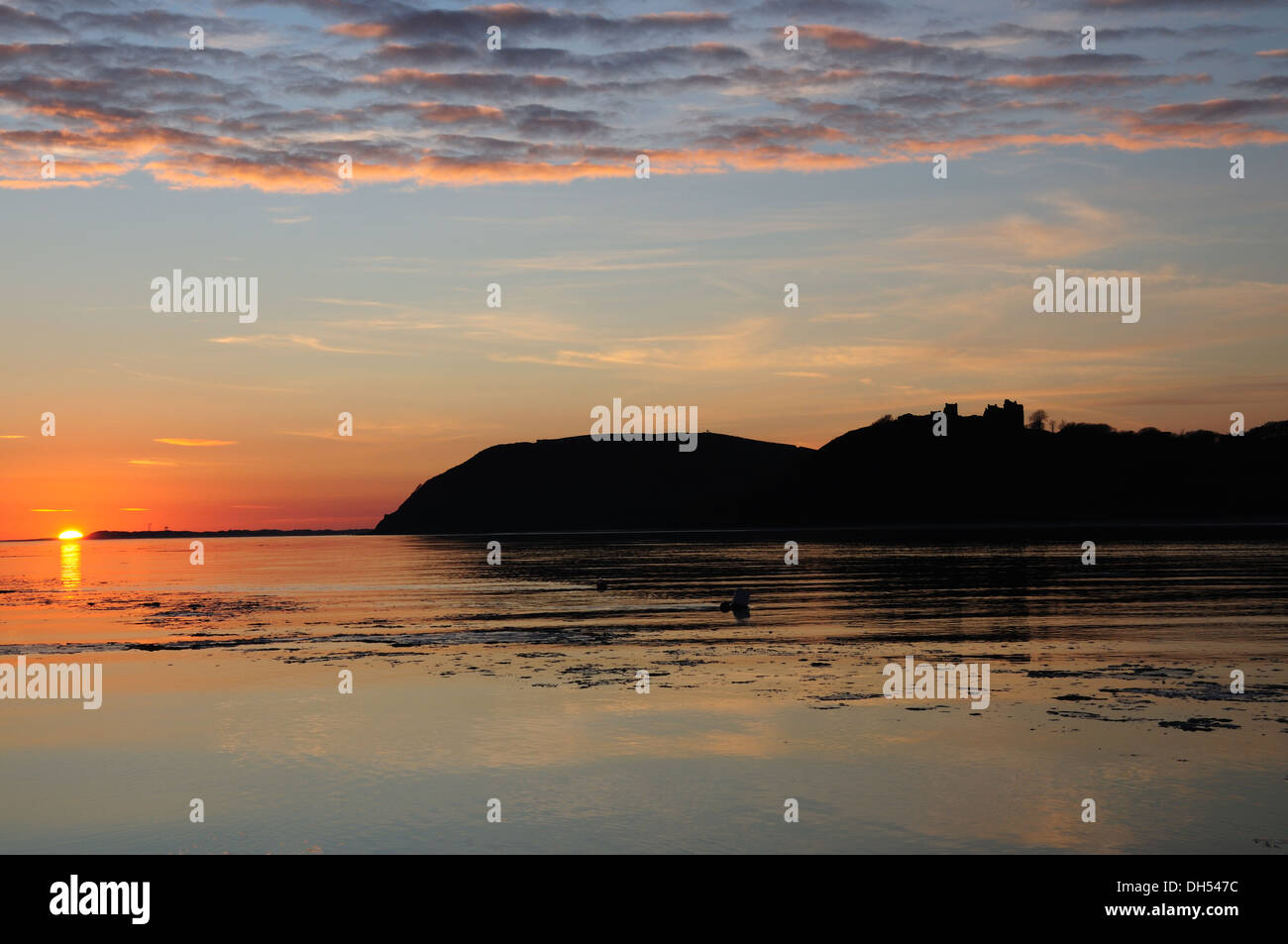 Mackerel sky at sunset over Llansteffan Castle and Tywi Estuary from