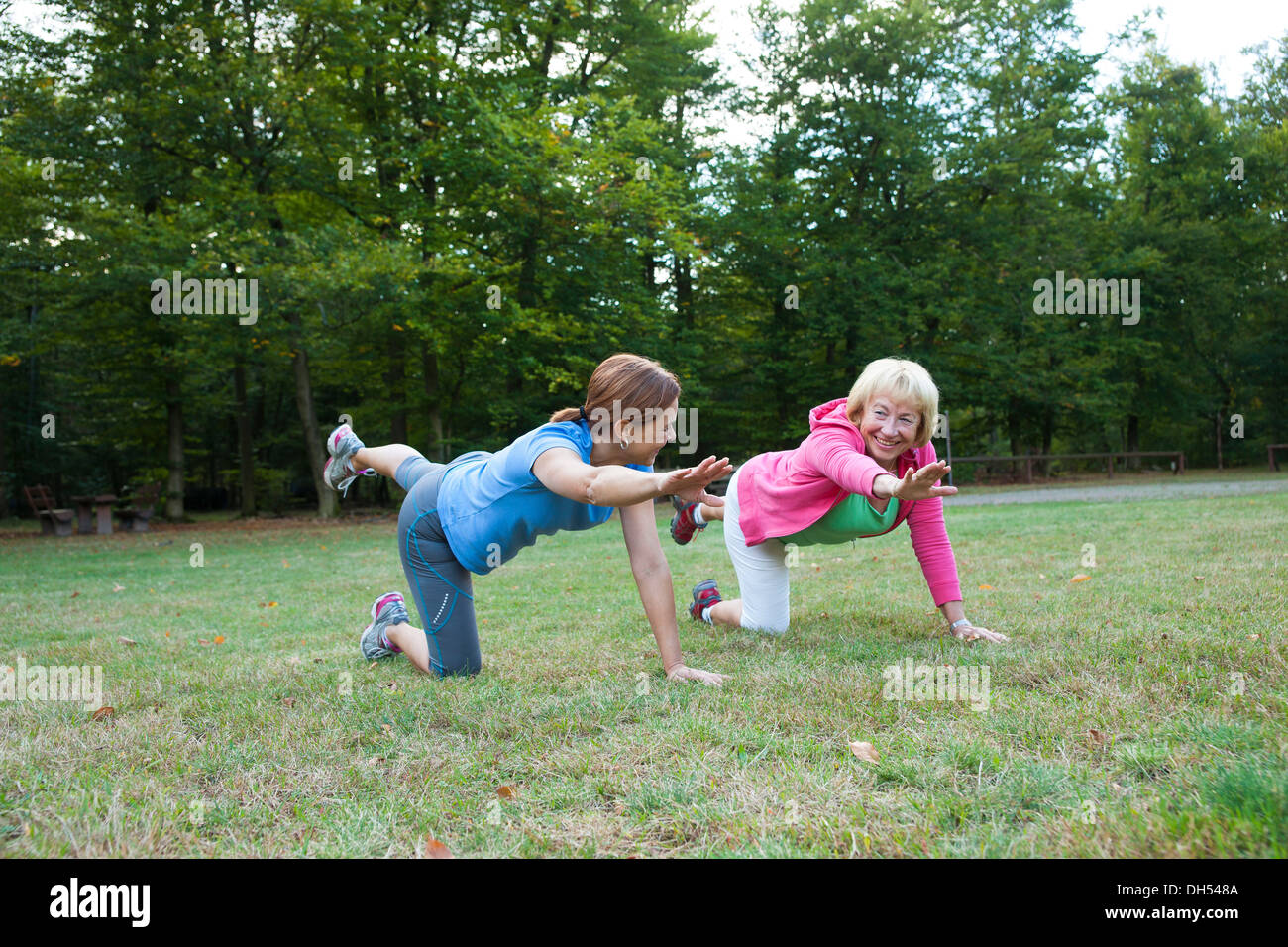 Women doing gymnastics outdoors Stock Photo
