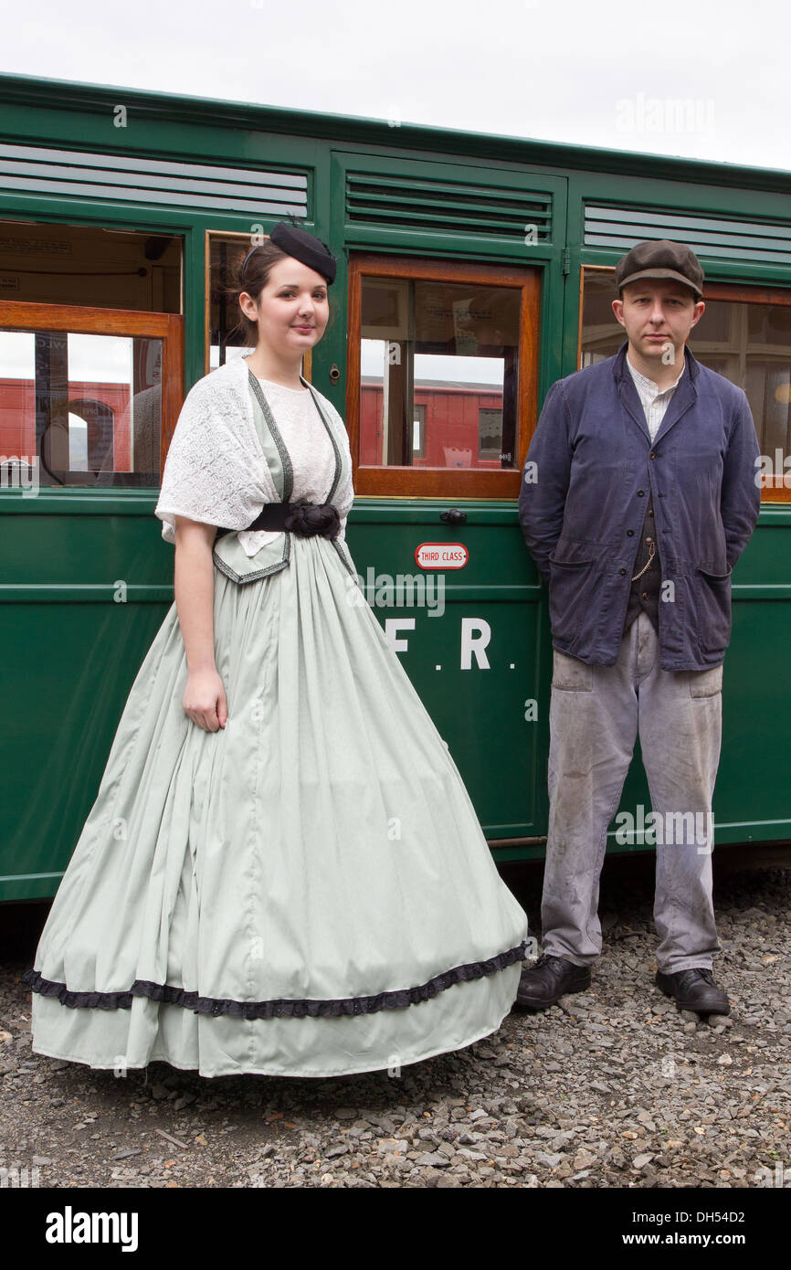 Victorian man and woman on the Blaenau Ffestiniog Railway, at Porthmadog, Wales Stock Photo