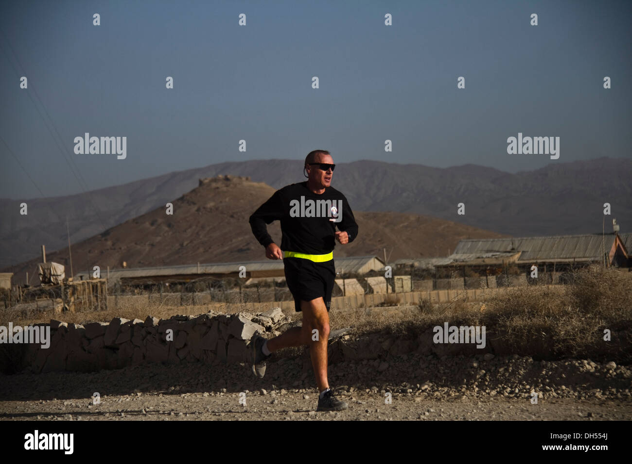 PAKTYA PROVINCE, Afghanistan – A U.S. Army Soldier with 1st Battalion, 506th Infantry Regiment, 4th Brigade Combat Team, 101st Airborne Division (Air Assault), begins his last lap while participating in a Run for the Fallen, Oct. 26, 2013. Stock Photo