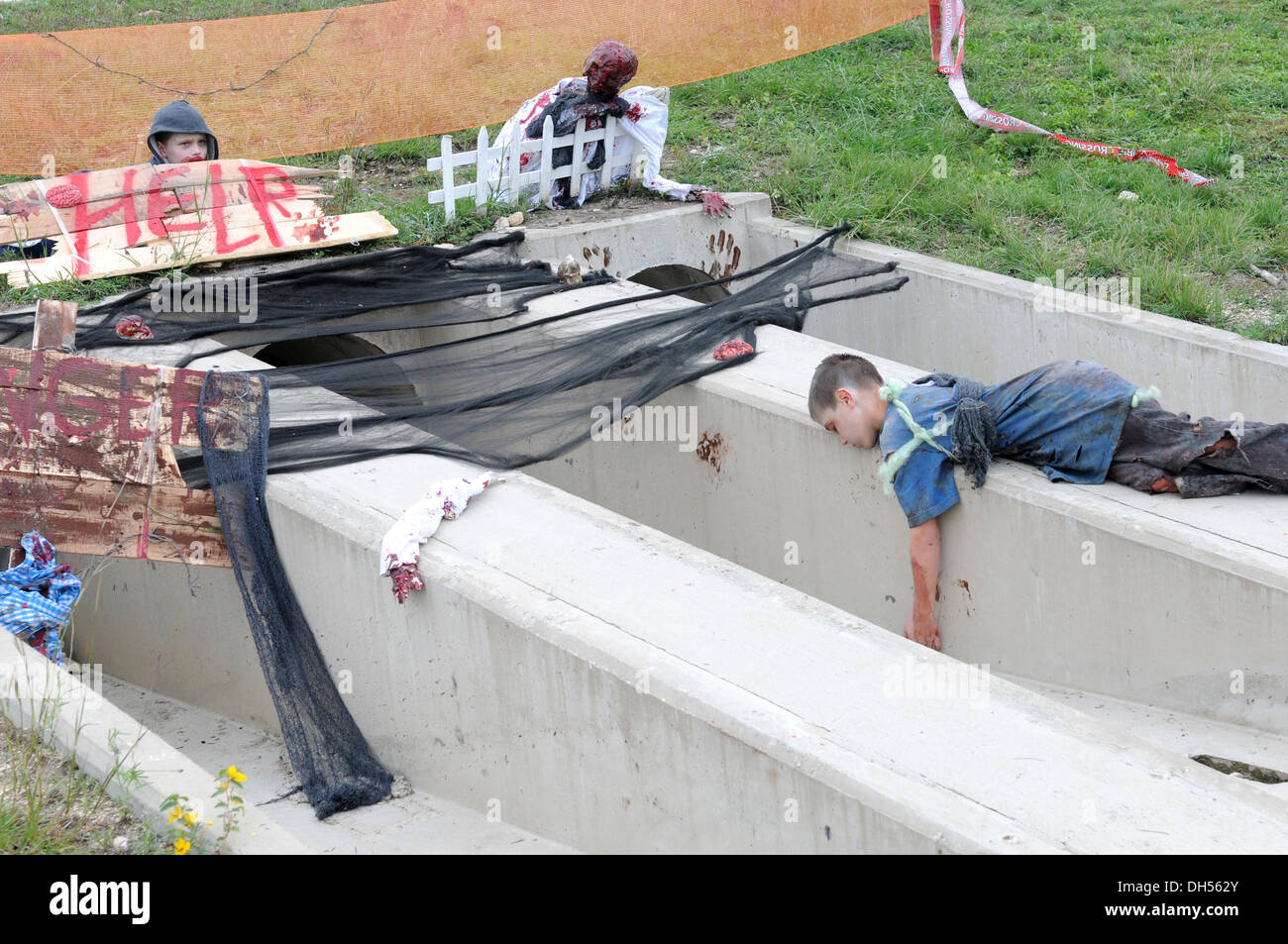 Zombie children occupy one of the obstacles during the zombie run at the Lightning Ranch here Oct. 26. Stock Photo