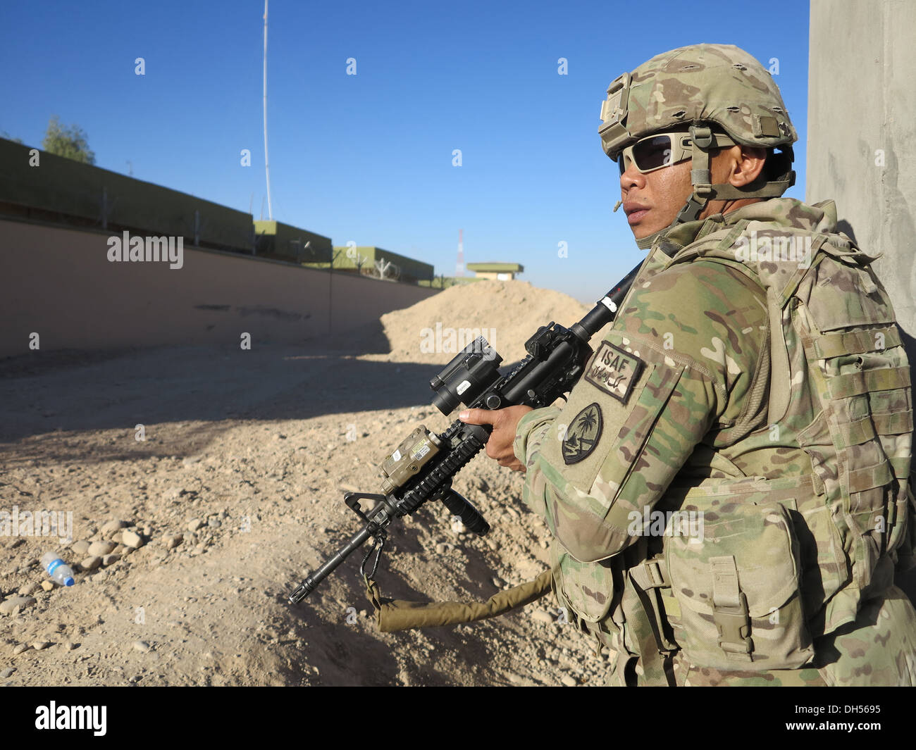 GUAM GUARDSMAN GUARDS -- Spc. Ignacio D. Meno of Bravo Company, 1st Battalion, 294th Infantry Regiment, Guam Army National Guard, scans his sector during a security mission late October at Main Operating Base LashKar Gah, Helmand Province, Afghanistan. Stock Photo