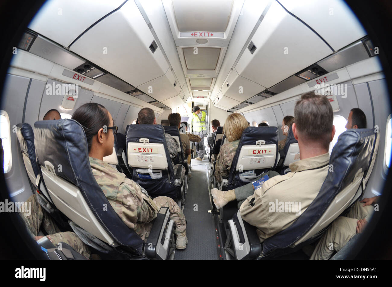 EYE OF THE FLIGHT -- Spc. Krissimay Q. Quintanilla, left, of Delta Company, 1st Battalion, 294th Infantry Regiment, Guam Army National Guard, waits with other passengers aboard a flight from Kandahar Airfield, Kandahar Province, to North Kaia in Kabul, Af Stock Photo