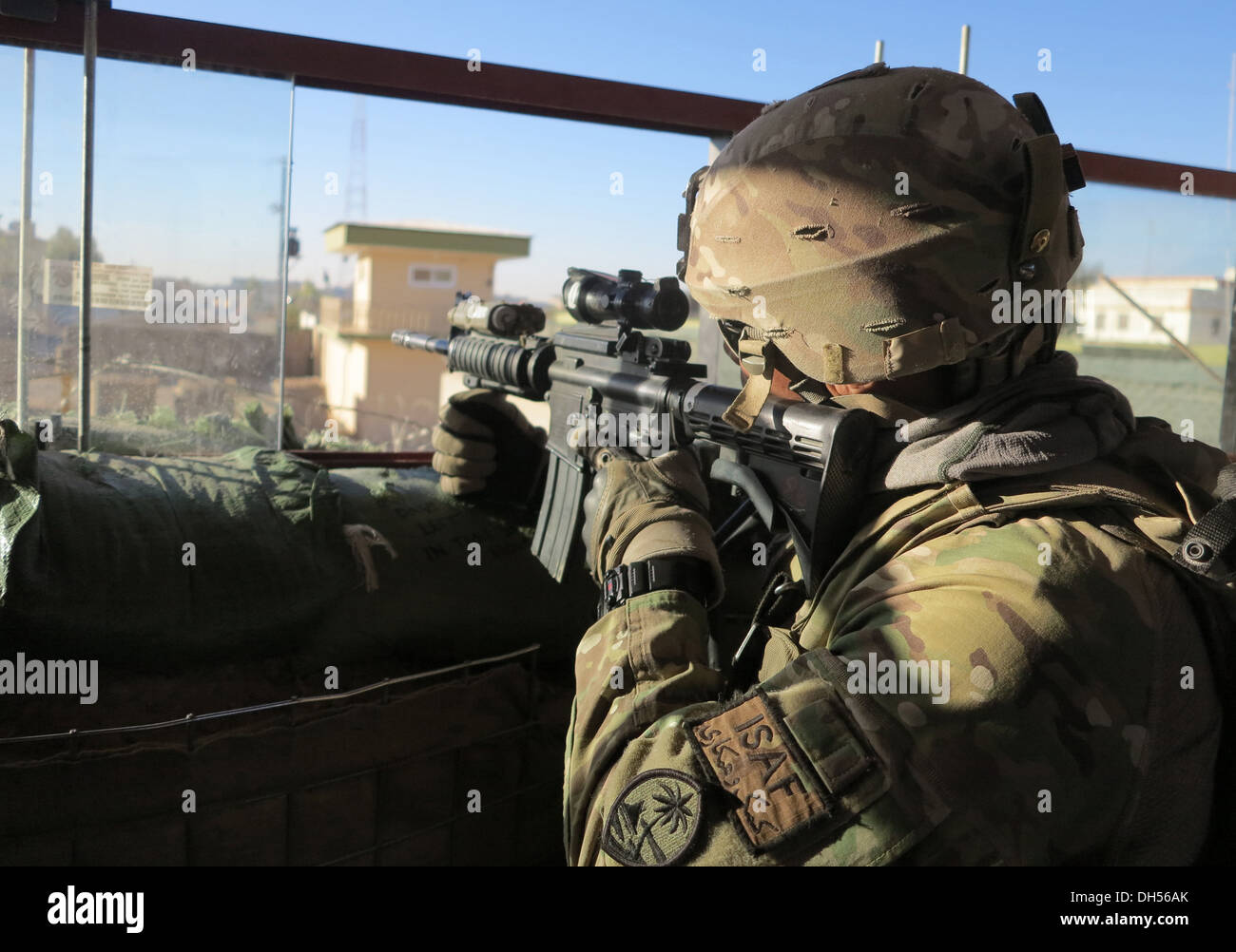 TOWER OF POWER -- Sgt. Albert Samana of Bravo Company, 1st Battalion, 294th Infantry Regiment, Guam Army National Guard, keeps eyes on movement at a Main Operating Base LashKar Gah tower late October in Helmand Province, Afghanistan. Stock Photo