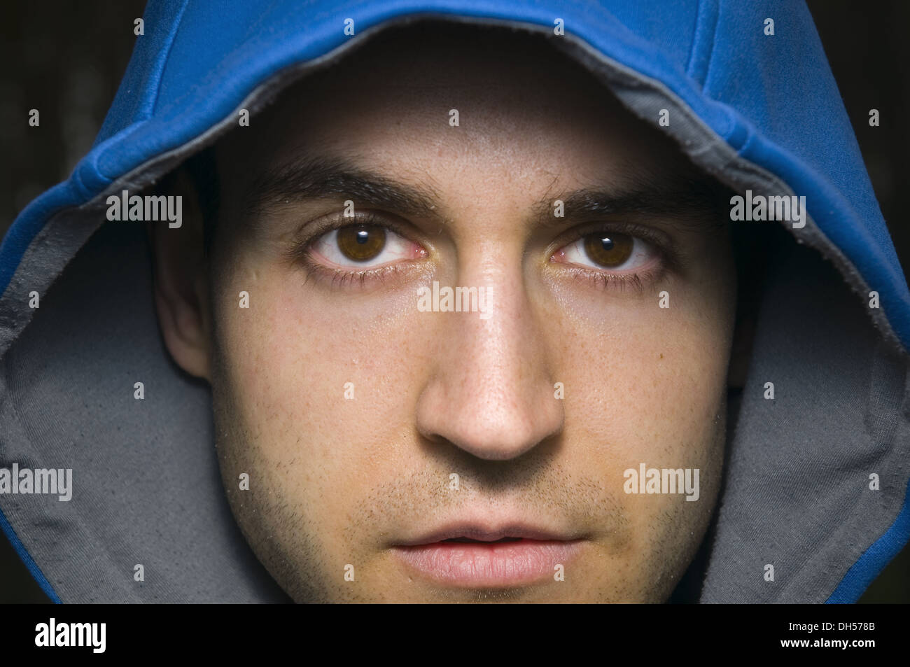 face of man with blue hood Stock Photo - Alamy