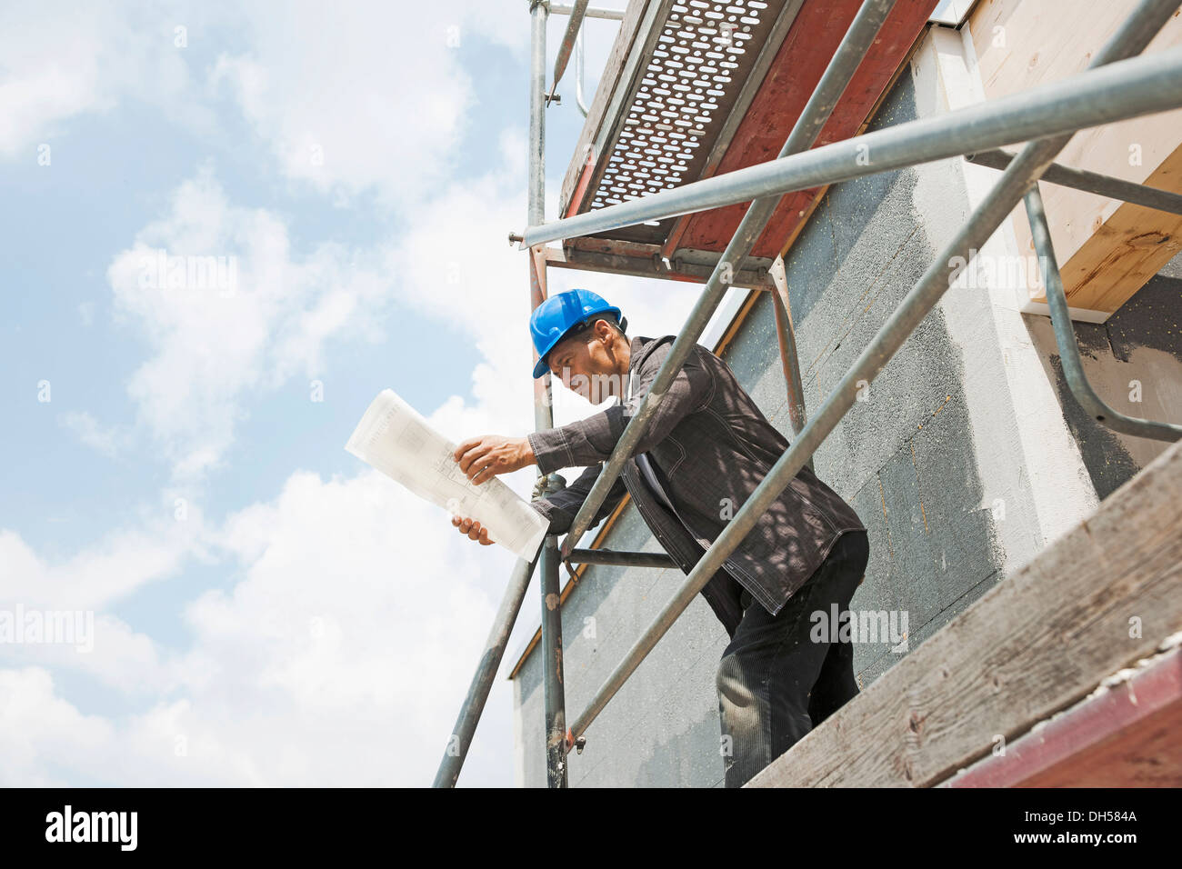 Construction manager controlling the building plans, Mannheim, Baden-Württemberg, Germany Stock Photo