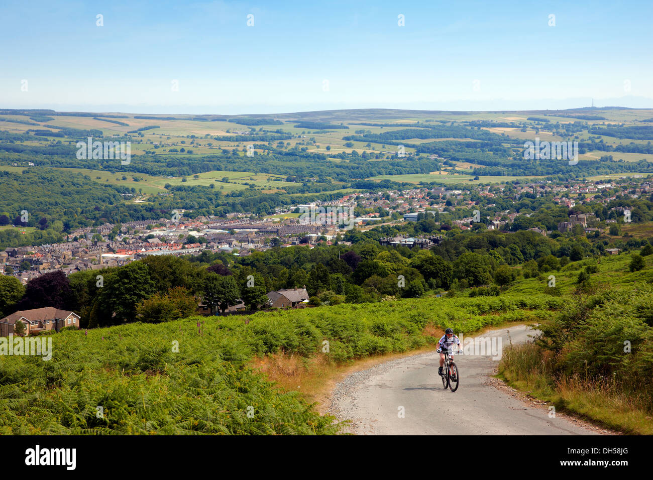 Cyclist on the old Keighley Road above Ilkley, West Yorkshire UK Stock