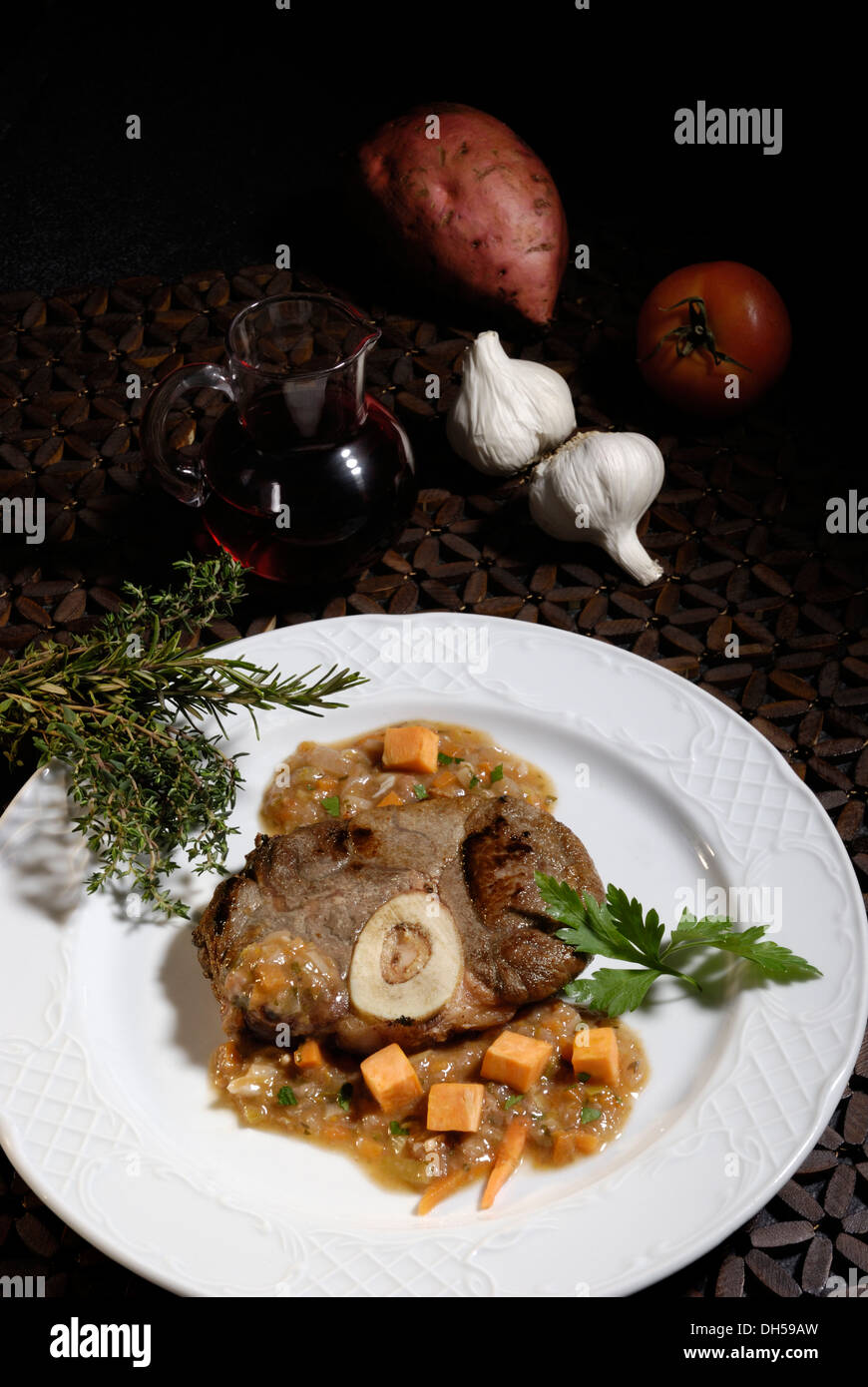 Ossobuco veal shank with sweet potatoes Stock Photo Alamy