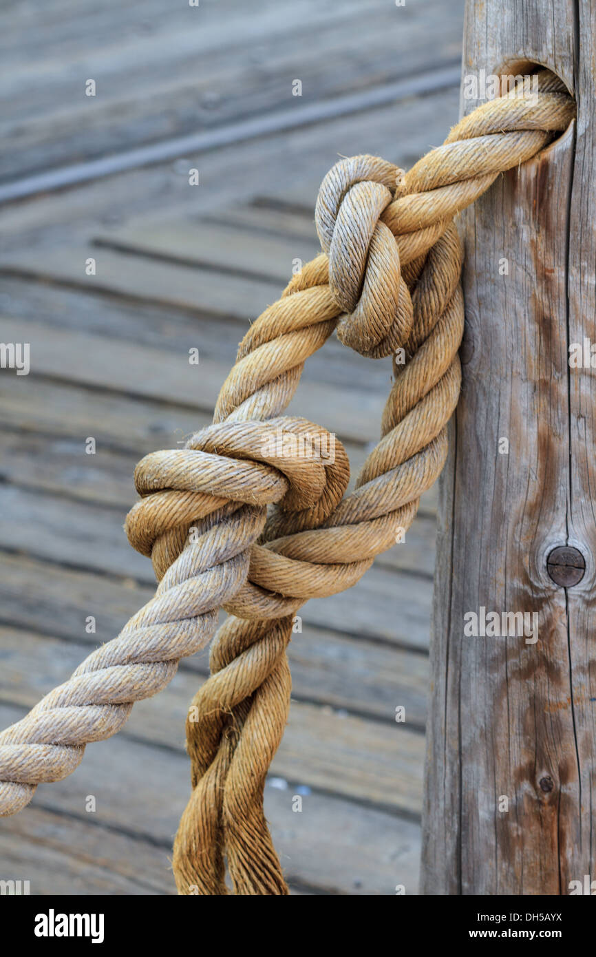 Knot attached to wooden pole Stock Photo
