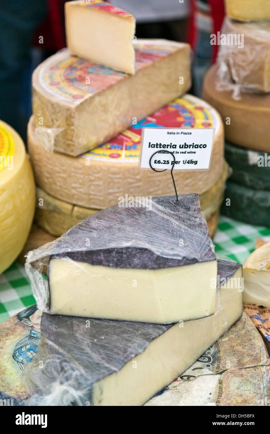 Latteria Ubriaco cheese matured in red wine for sale in market stall at Italian Festival 21 Sept 2013, Peterborough, England Stock Photo