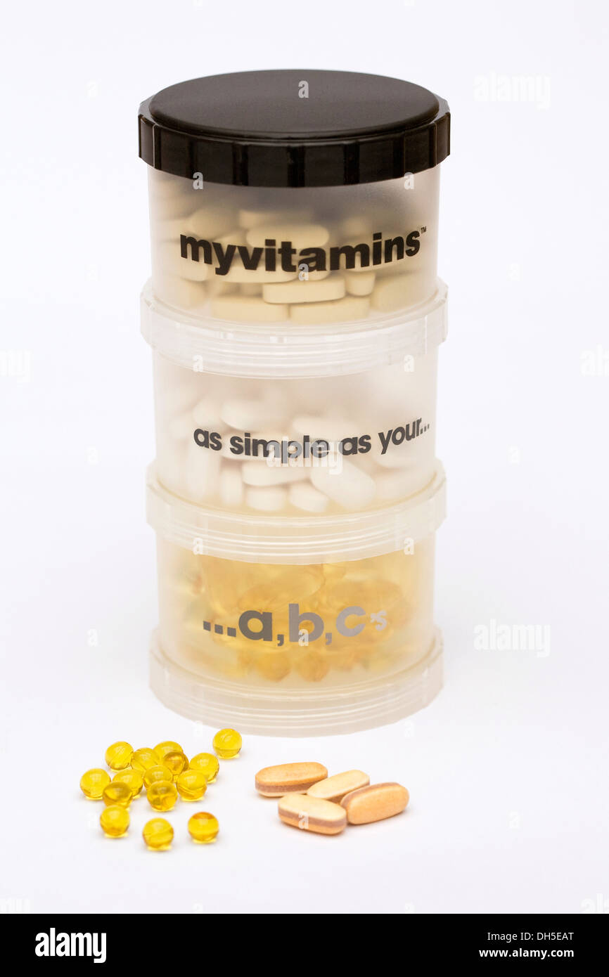 Storage container for vitamin and mineral supplements. Stock Photo