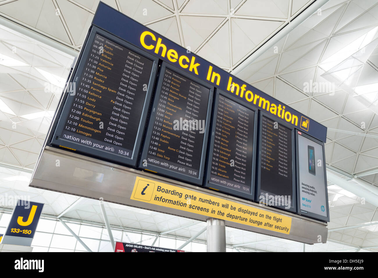 Check-in information display board at Stansted Airport, England, UK Stock Photo